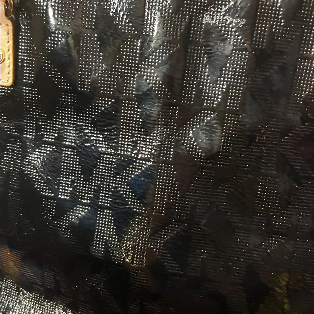 Michael Kors Jet Set Chain Tote in black patent leather with gold hardware.
